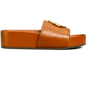 Tory Burch Patos iconic circle gold decal.